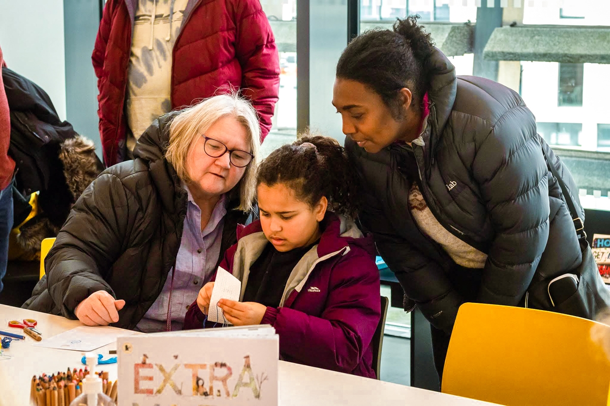 A family doing arts and crafts in the learning studio at V&A Dundee