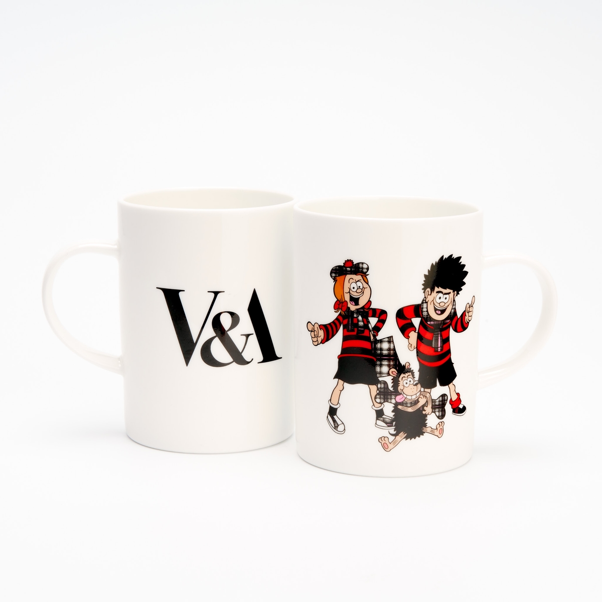 A ceramic mug with the V&A logo on one side and Beano characters on the other