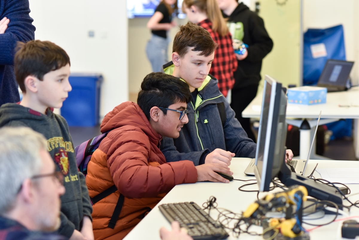 A group of school pupils using a computer