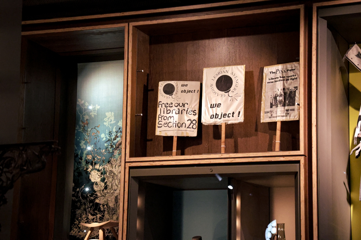 A collection of hand made signs used by the Glasgow Lesbian Avengers group in protest of Section 28, on display at V&A Dundee