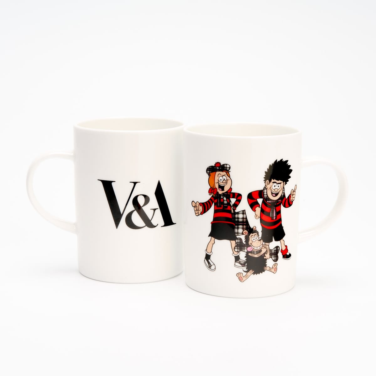 A ceramic mug with the V&A logo on one side and Beano characters on the other