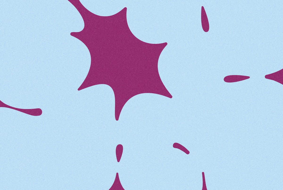 Abstract image with purple starburst shape and smaller spots on a light blue background, creating a dynamic pattern.