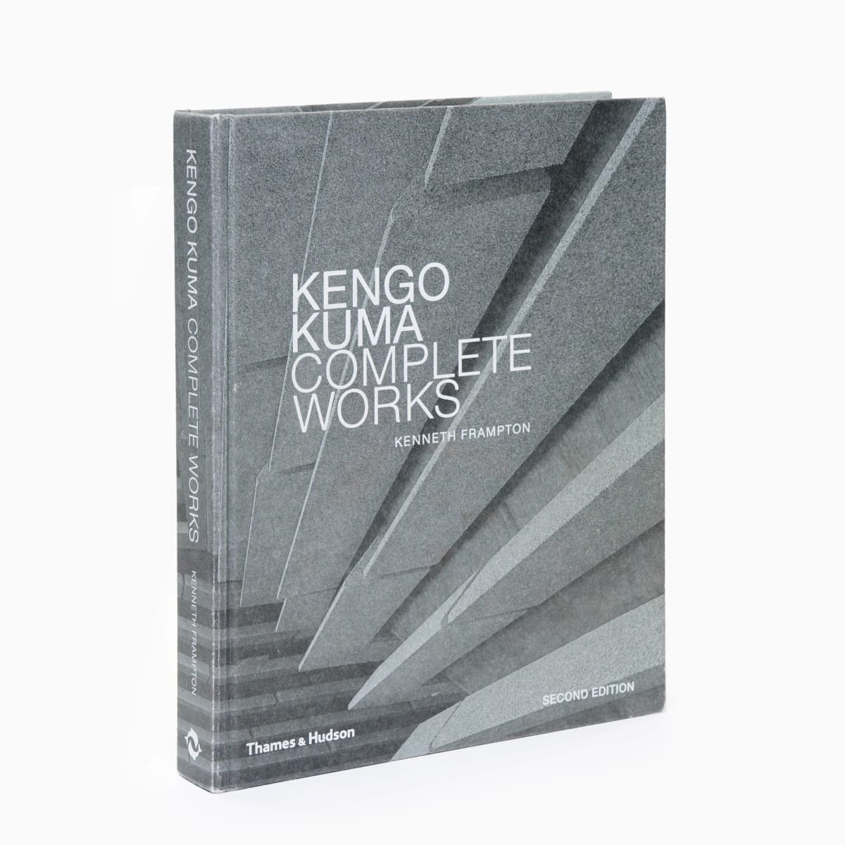 A grey book titled 'Kengo Kuma Complete Works'
