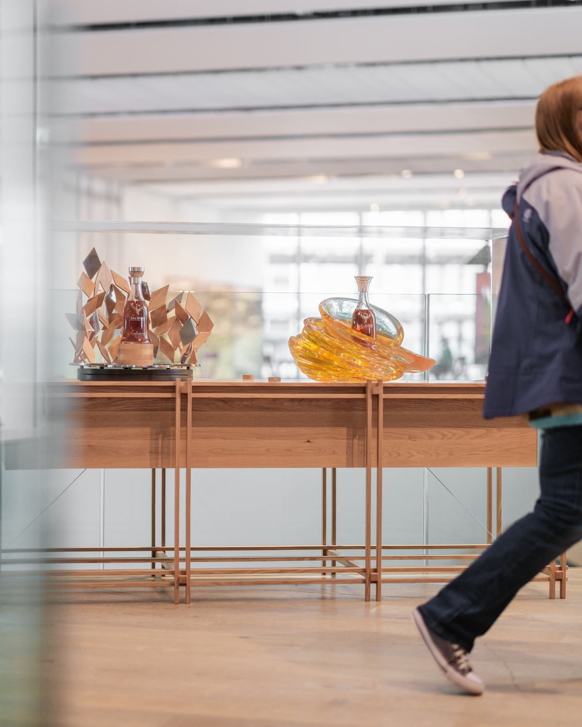 A visitor passing the plinth