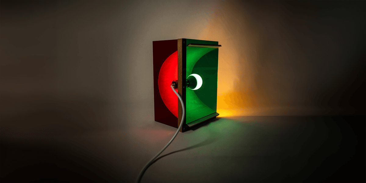 Photograph of a rectangular red and green lamp